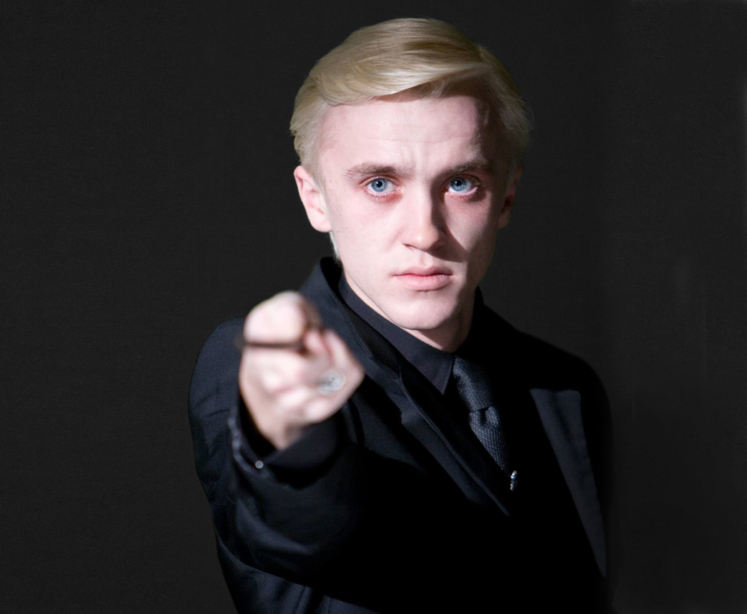 Draco Malfoy holds up his wand — Harry Potter Fan Zone