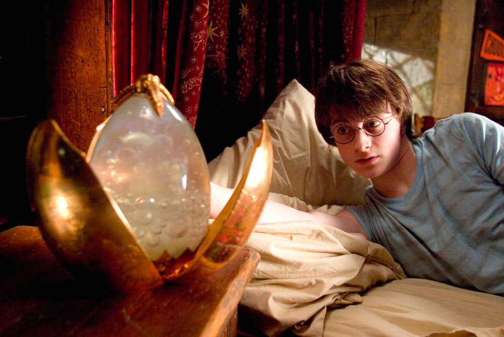 Harry examines his golden egg