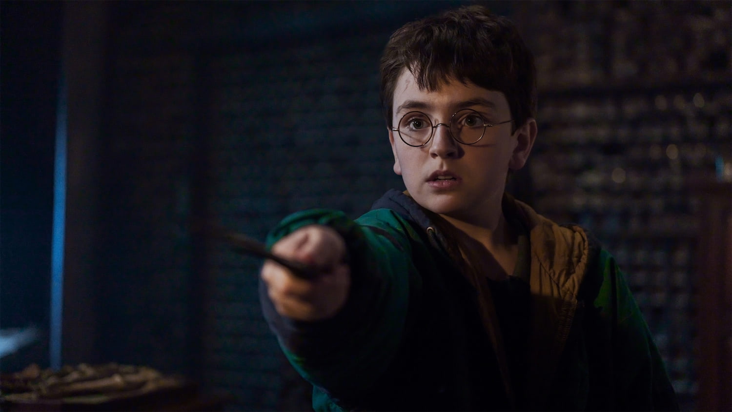 Harry holds his wand