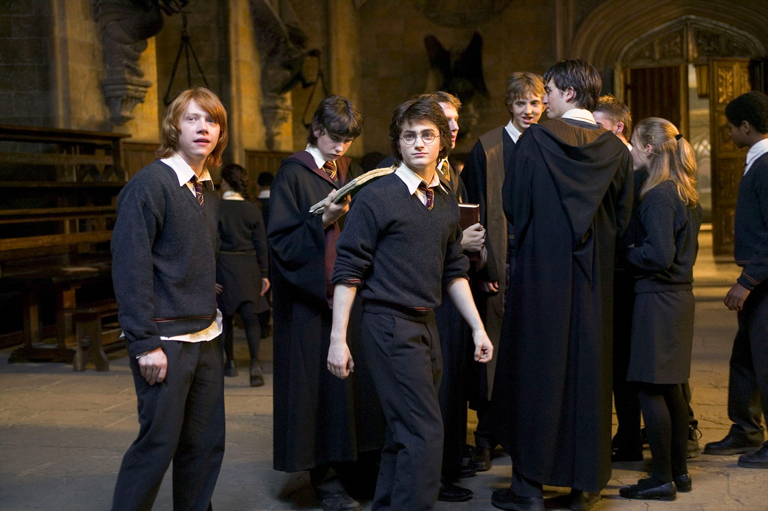 Harry, Ron, Neville and Cedric in the Great Hall