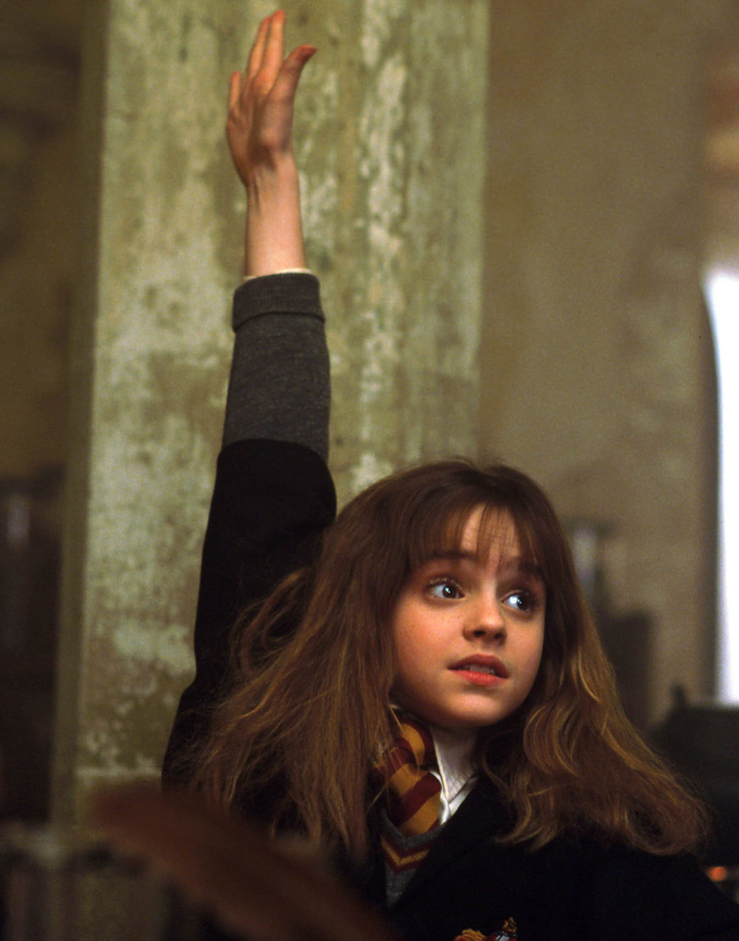Hermione raises her hand